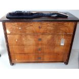 A 19th century walnut and ebonised Biedermeier style secretaire chest, the rectangular moulded top