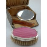 A ladies silver and pink guilloche enamelled brush, hallmarked Birmingham 1927, together with comb