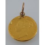 A Victorian gold shield half sovereign, dated 1874, converted into a pendant.