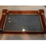 A late Regency rectangular overmantel mirror, the frame with split turned columns and silvered