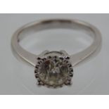 An 18 carat white gold and solitaire diamond ring, set old cut stone of approx. 1.0 carats.