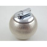 A silver cased Witchball table lighter by Comyns of London.