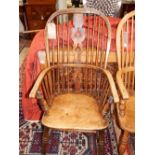 A late 19th century ash and elm Windsor chair, with a pierced fruitwood splat and contoured seat