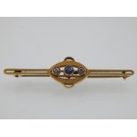 A yellow gold, diamond and sapphire set bar brooch, stamped 15ct.