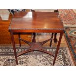 A 1920's Georgian revival rectangular mahogany side table with gadrooned top on chamferred legs with