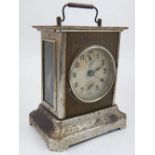 A German carriage/alarm clock, with a chrome case, the dial set out in Arabic numerals, H. 16cm.