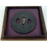 A Kamakura period tsuba, pierced and engraved with flowers and foliage,