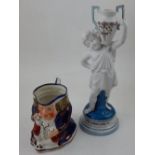 A late 19th century German porcelain spill vase modelled as a classical boy supporting a jeweled