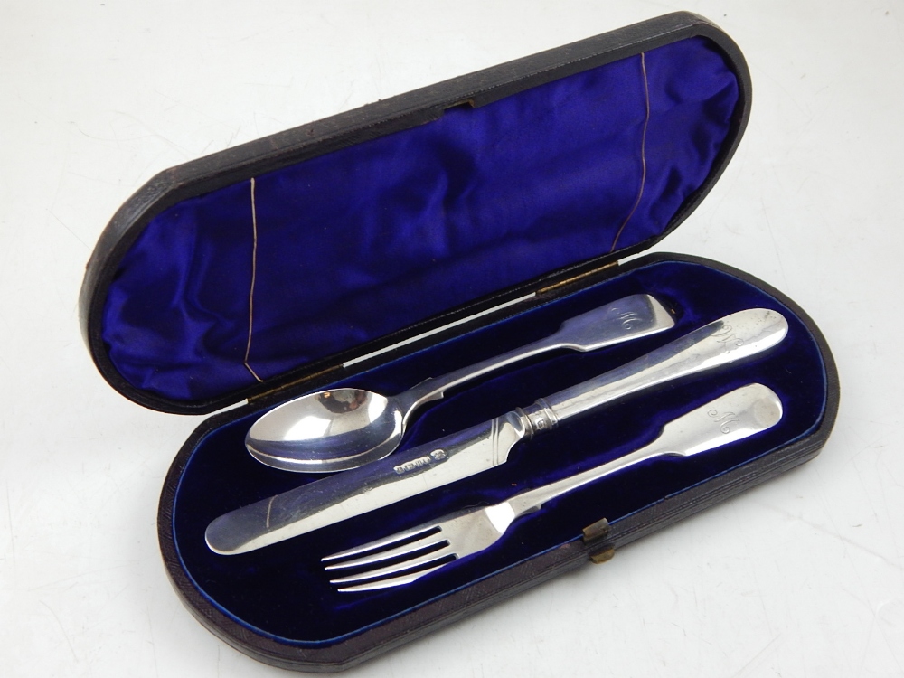 A Victorian silver three piece fiddle pattern Christening set, Sheffield 1851, cased.