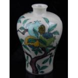 A Chinese Sancai style baluster vase, decorated with pomegranate trees and incised dragons,