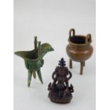 A Chinese bronze twin-handled incense burner, raised on tripod feet, bears seal mark to base,