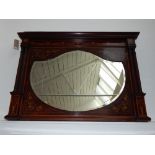 A mahogany overmantle mirror in the manner of Edwards and Roberts,