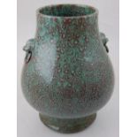 A Chinese twin-handled mottled red and green glazed baluster vase,