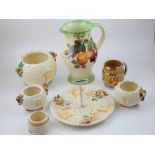 Clarice Cliff Bizarre sugar bowl together with four later Clarice Cliff Celtic Harvest pieces,
