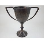 A silver twin handle trophy cup, London 1925, engraved with a presentation inscription, 8ozt.