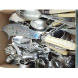 A quantity of plated flatware, including fish servers and various spoons and forks,