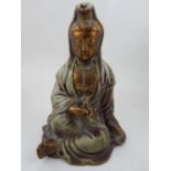 A Chinese gilt decorated celadon porcelain figure of Guanyin. H.