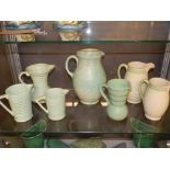 A collection of seven 1930s / 50s pottery jugs, including examples by Price Bros, Newhall, etc.