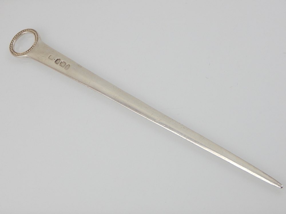 A George III silver meat skewer, George Greenhill Jones London 1781, with beaded ring handle. L.