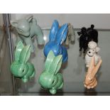 Four Sylvac pottery rabbits, in blue, green and brown glazes, largest 12cm,