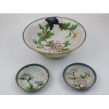 A Chinese cloisonne bowl, decorated with flowers on a cream scale ground,