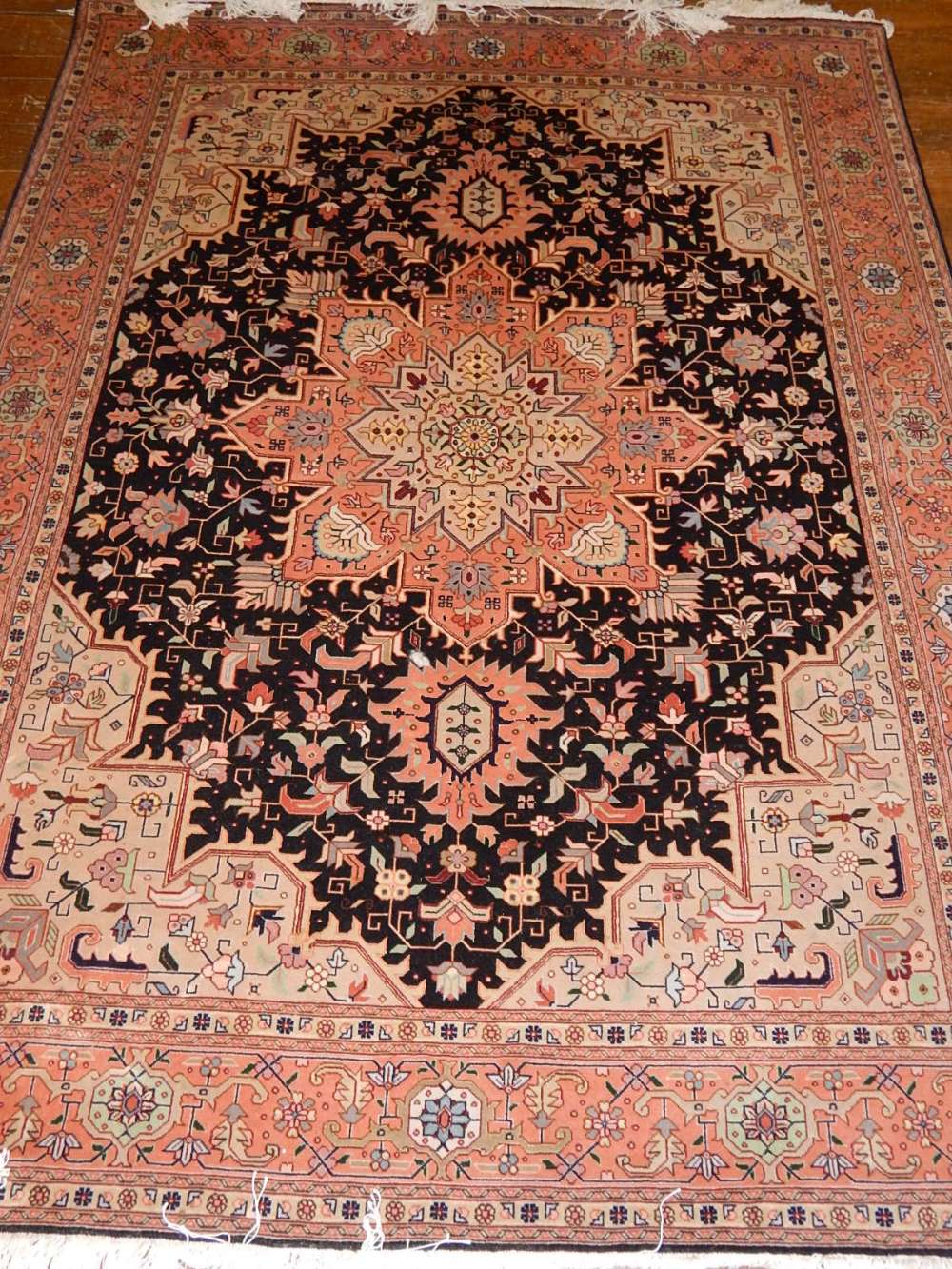 WITHDRAWN - A fine Persian tabriz rug, with unusual Heriz design,