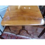 A Victorian mahogany occasional table, the rectangular top above a turned support and tripod base,