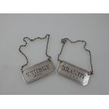 A pair of decanter labels, Birmingham 1988, rectangular with canted corners, marked Brandy & Whisky,