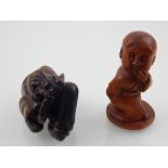 A carved hardwood netsuke, modelled as an immortal, the base bearing a signature, 4.