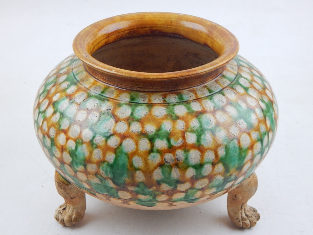 A tang style ceramics bowl, raised on three paw feet, H.