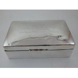 A silver cigar box, Birmingham 1920, of rectangular form with a domed lid,