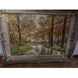 Gerrit Van Jeveren (Dutch, 1904-1986), view of a river through a wood in Autumn, oil on canvas,