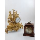 A 19th century style French gilt metal mantel clock, together with a wooden mantel clock.