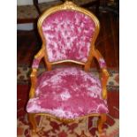 A Louis XVI design giltwood fauteuil, upholstered in vivid pink plush fabric,