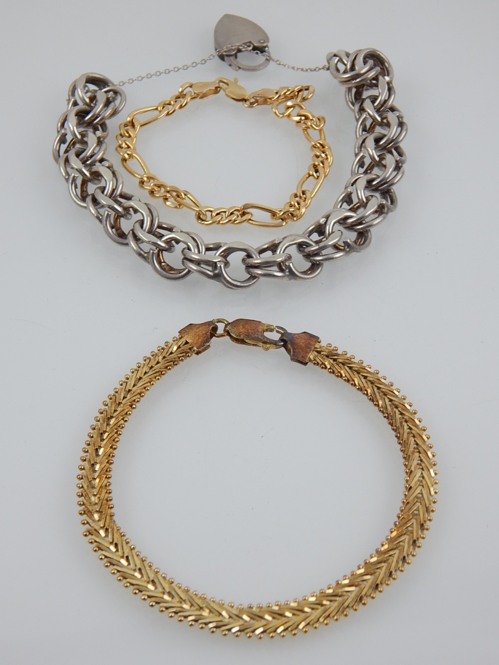 A 9 carat yellow gold figaro chain bracelet, stamped 375,
