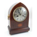 An early 20th century mahogany lancet shaped mantel clock,