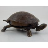 A bronze table bell, modelled in the form of a tortoise,