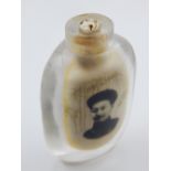 A Chinese reverse painted snuff bottle (missing stopper),