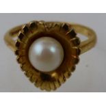 A 9ct gold and pearl dress ring of leaf form.