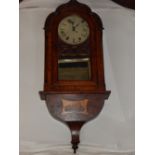 A late Victorian walnut framed wall clock,