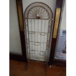 An architectural arched steel garden potted plant stand,