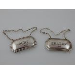 A pair of decanter labels, Birmingham 2003, rectangular with canted corners, engraved Brandy & Port,