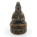 A Chinese bronze Guanyin seated on a lotus base. H. 7.