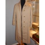 A ladies Burberry beige trench coat, having traditional check interior, approx size S.