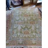 A cream ground Turkish rug, decorated with stylised floral design, fringed, L. 240cm, W.170cm.