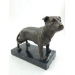 A bronze model of a Staffordshire Bull Terrier, W. 19cm.