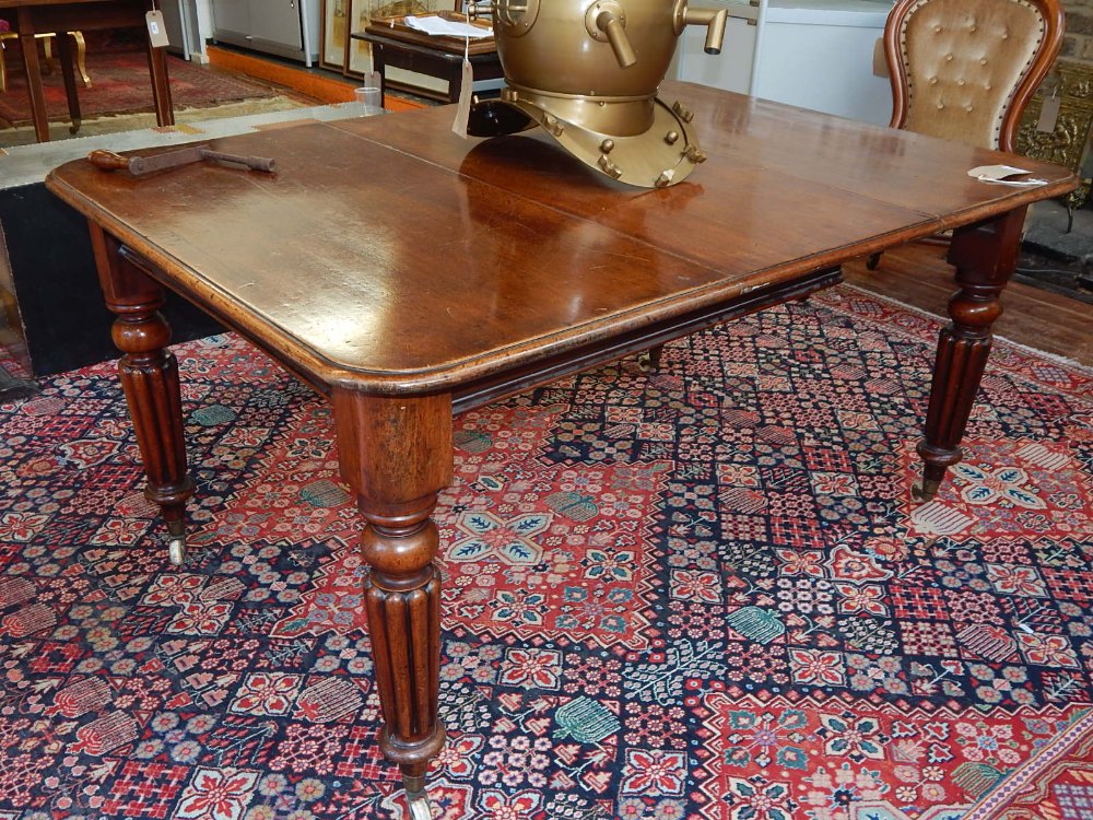 A Victorian mahogany extending dining table,