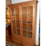 A Victorian pine cupboard,