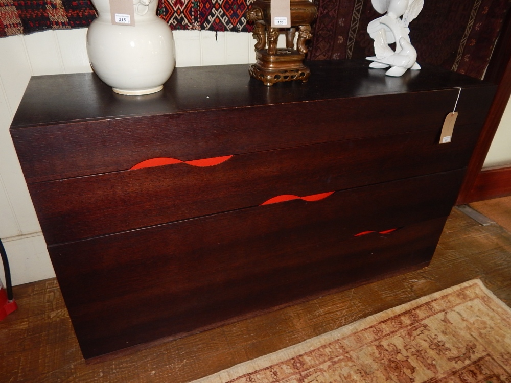 Heals of London, a slice style four drawer chest, the recessed handles with a red ground, W, 160cm.