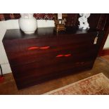 Heals of London, a slice style four drawer chest, the recessed handles with a red ground, W, 160cm.